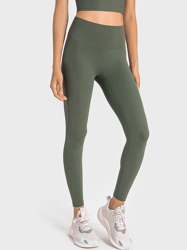 بنطال ضيق بخصر عالٍ وملمس عاري