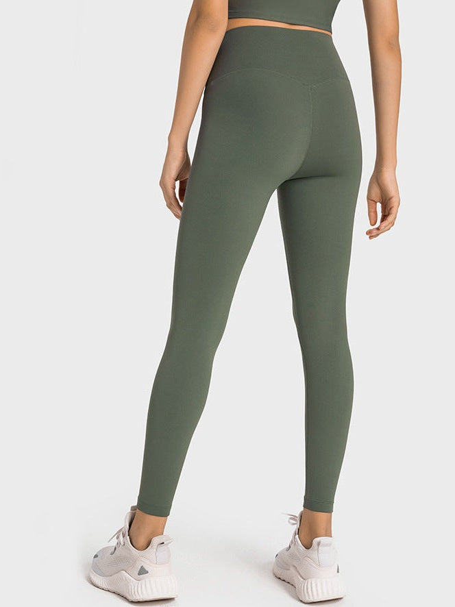 بنطال ضيق بخصر عالٍ وملمس عاري